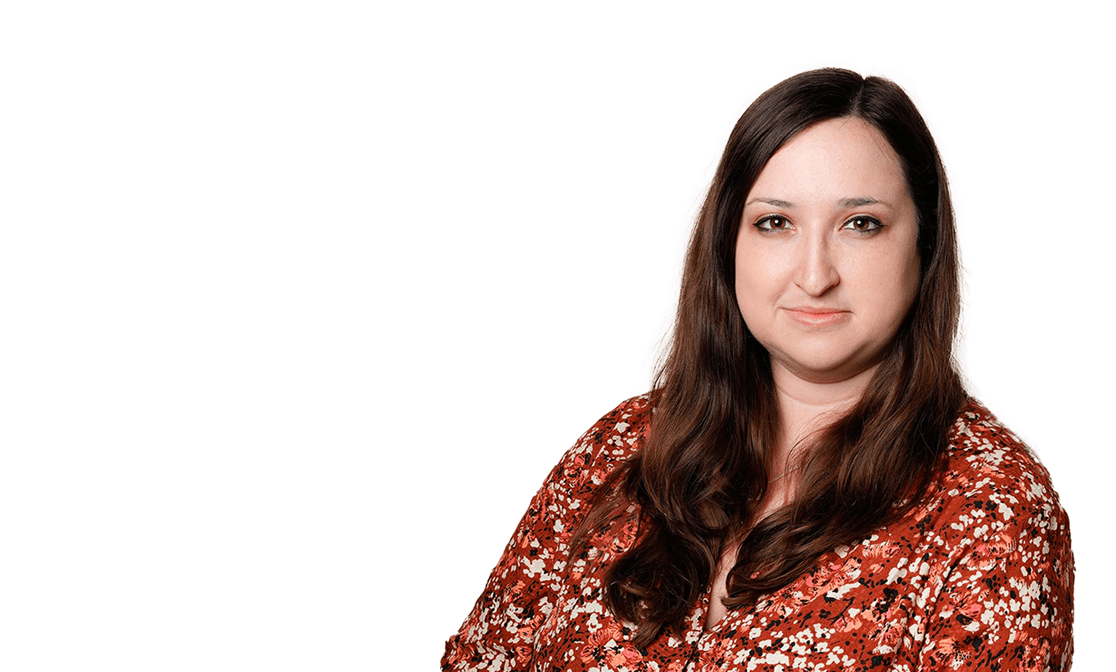 Woman with long dark brown hair wearing a red floral patterned blouse.